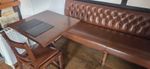 10 aged oak tables with over 40 chairs 