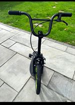 sbyke Black Push Scooter Large Front Wheel with Green Rim Accents