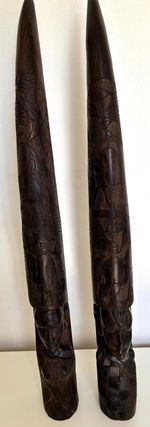 A pair of Antique original hand carved hardwood African tusks