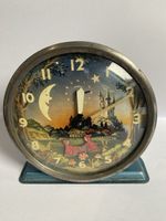 A vintage Westclox "Pixie" animated alarm clock from the 1950s.