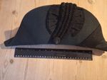 vintage or antique black silk-trimmed bicorn hat (also known as a cocked hat