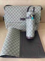 Mom diaper bag with changing mat and bottle holder
