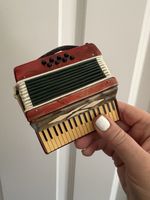 Miniature Decorative Accordian red pearl finish black case red velvet lining