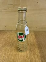 Vintage Castrol 1 pint oil bottles with original caps.