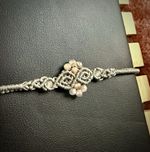 Handmade grey macrame bracelet w/ sunstone and labradorite crystals