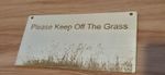 keep off the grass sign