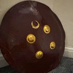 round brown and golden shield buffalo leather 20 inches.