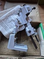 Drill bit grinding attachment for sharpening high speed twist drills
