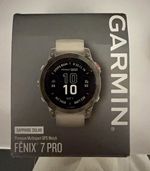 Garmin fēnix 7 Pro Sapphire Solar Multisport GPS Watch, Orange Band with charger