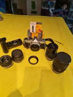 Olympus OM1 SLR Camera With 4 Lenses And Accessories