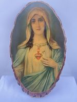 The Virgin Mary with her flaming, sword-pierced Immaculate Heart.