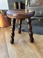 French Vintage wooden stool, round seat, bobbin-turned legs with a dark finish.