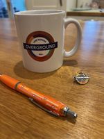 London Overground 2024 Line Naming Mug, Pen And Pin Badge