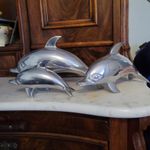 three aluminium dolphins in good condition