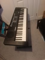 Electric Keyboard with Stand, and stool, stool missing screws, battery powered.