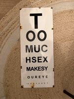 Comedic opticians enamel advertising sign