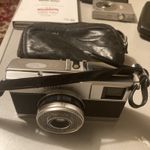 OLYMPUS EES QUICKMATIC 126 - working   with a black leather case. 