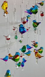 Handmade Glass Bird Hanging Suncatcher Clutching A Crystal Heart, 6 Colours
