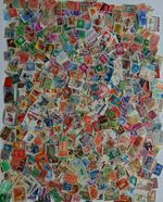 Postage Stamps world. Enclosed 2000 plus stamps hours of fun