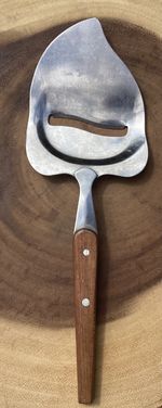 Vintage Scandinavian style stainless steel cheese slicer with wooden handle