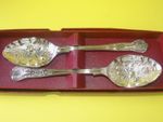 A Pair of Fruit Decorated Serving Spoons