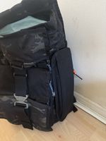 This is a Mission Workshop Speedwell backpack in black camouflage.