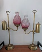 A pair of Victorian brass lamps with glass shades 