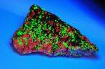 Fluorescent minerals. Willemite, Franklinite and Calcite, Sterling Hill Mine.