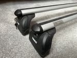 Thule roof bars for 2004 Mercedes-Benz E Class saloon (W211) with keys.