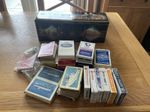 OLD RAFFLES CIGARETTE TIN FULL OF VINTAGE PLAYING CARDS. SOME SEALED. LOOK!