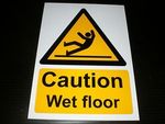 CAUTION WET FLOOR sign or sticker slippery fall slip hazard warning