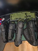 Black Hard Shell Strapped Protective Pads for Motorcross Or Xtreme Sports