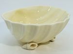 Porcelain shell-shaped bowl titled 'Neptune Yellow' by Belleek Pottery