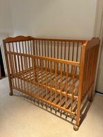Wooden Cot Bed with adjustable heights and wheels