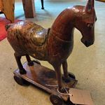 Folk art ceremonial hand carved horse on wheels