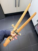 Pair of Wooden Toy Swords 58cm rope handle Tower of London? Used East London 