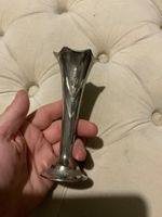 AN ANTIQUE CONICAL BUD VASE WITH A FLUTE MOUTH WHEAT DESIGN