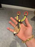 Resin Goldfinch Handle Catapult. Red White And Yellow Slingshot