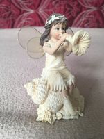 Mythical and Magical Fairy Sat On a Shell Playing Bugle Flower Collectable