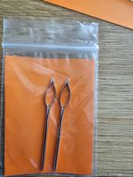 A pair sister locs/ locks retightening hair tool needle