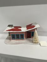 decorative miniature house commonly referred to as a Christmas village house