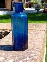Vintage medicine Bottle Not To Be Taken / Ribbed / Shaped Bottle blue.