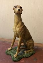 Vintage Greyhound or whippet sitting dog figurine 18cm. Felt base