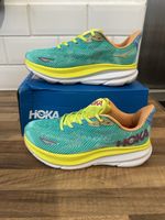 HOKA Clifton 9 running shoes in the highly vibrant "Ceramic / Evening Primrose"