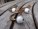 3 Original Victorian ornate brass cable twist hooks with porcelain ends