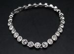 SWAROVSKI RHODIUM PLATED 6.5'' Round-cut Tennis Bracelet, 14.52g