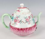 An 18th Century Chinese famille rose porcelain teapot and matched cover 雍正粉彩贴塑茶壶