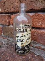 Lockheed One Pint Hydraulic Brake Fluid Bottle Vintage Classic Car Garage