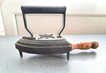 Antique cast iron flat iron and trivet stand