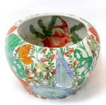A Chinese famille rose fishbowl decorated with flowers and goldfish, 37cms (14.5